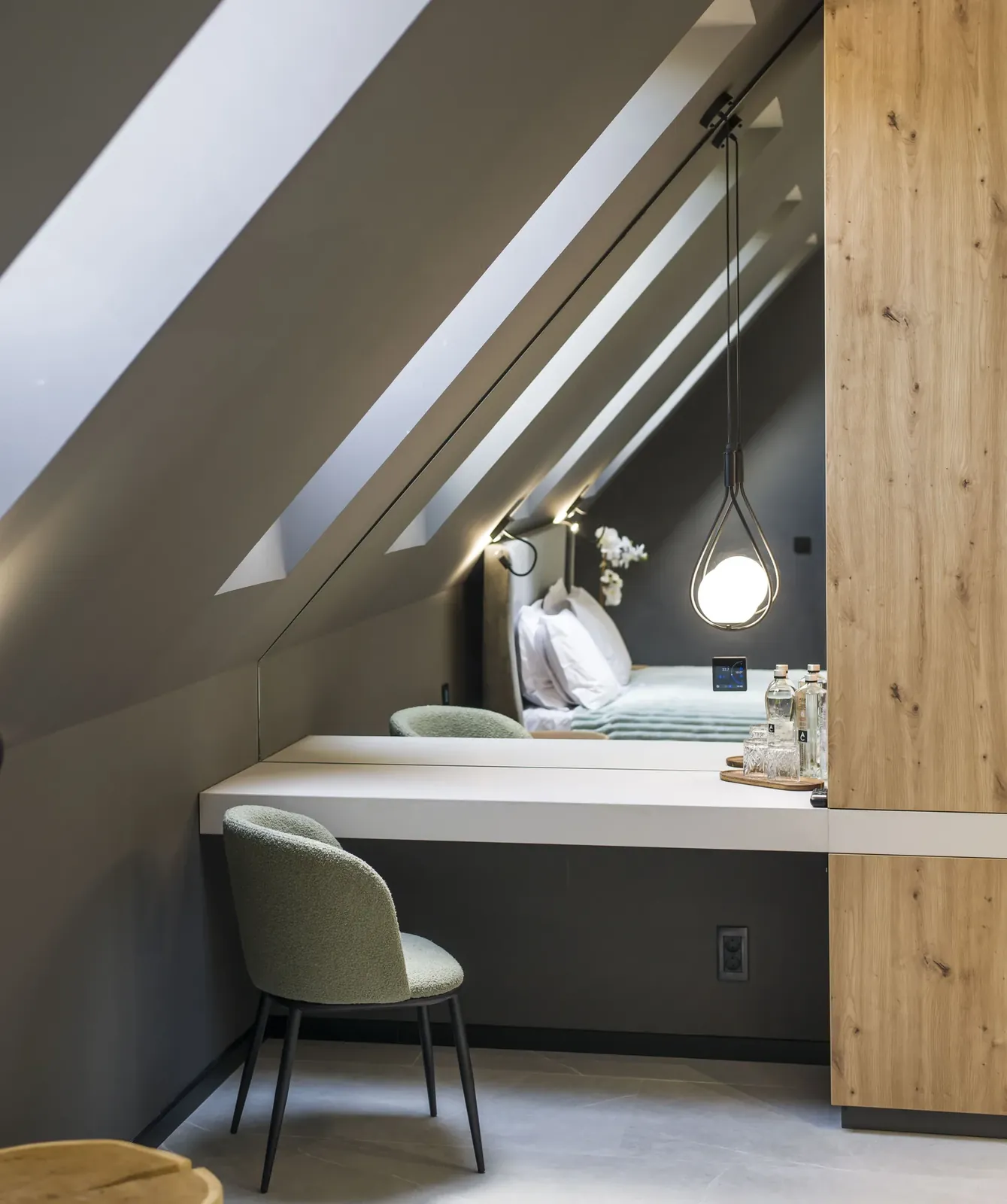 Desk beneath the loft skylights with green chair, room at MAPAMONT Văliug