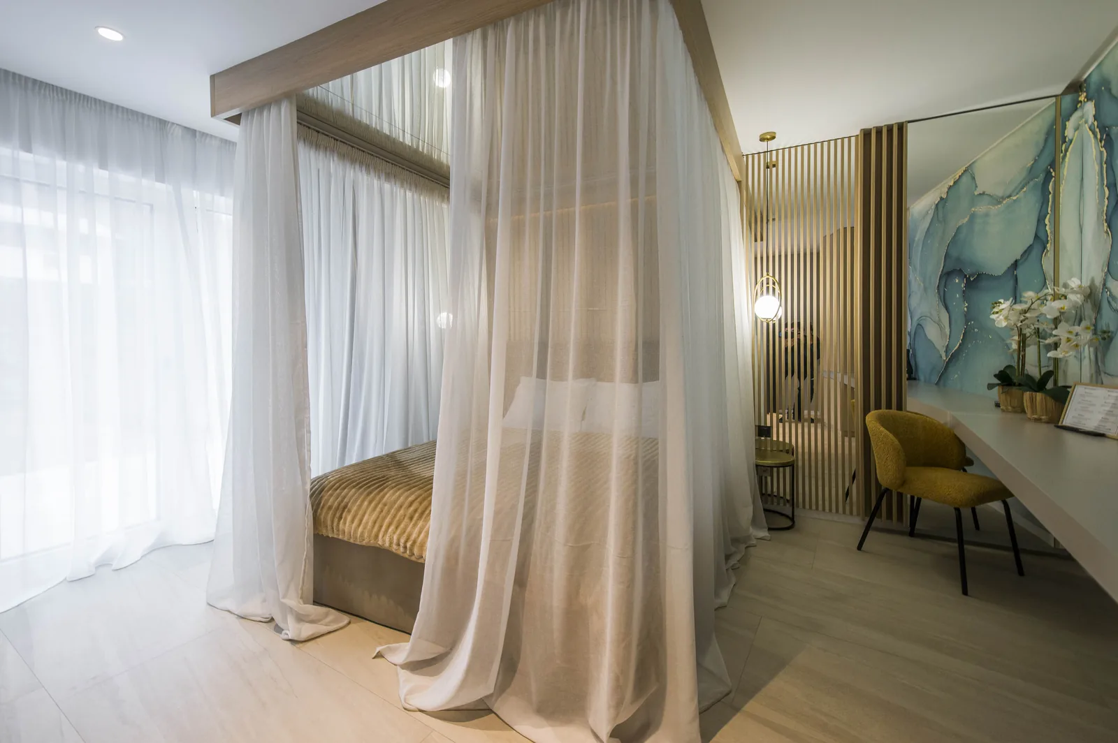 Canopy bed draped in sheer voiles, with a mirrored ceiling, VIP Room MAPAMONT Văliug