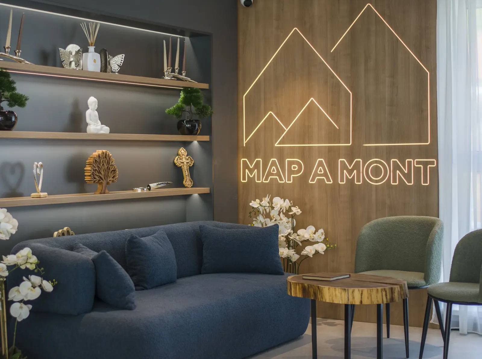 Lounge area with the MAPAMONT logo, guesthouse in Văliug, Semenic Mountains