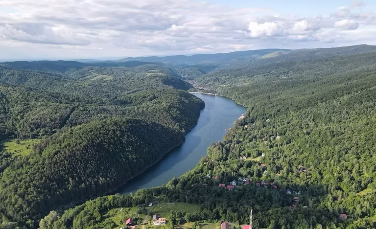 Aerial view of Gozna Lake and the Semenic Mountains, Văliug, Banatul Montan