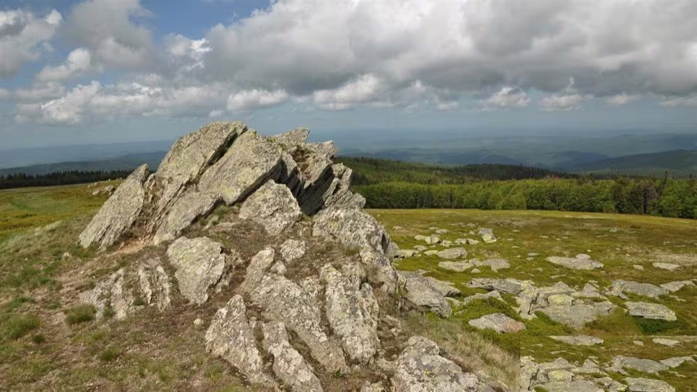 Rocky ridge on the Semenic plateau with a panorama over Banatul Montan, near Gărâna and Brebu Nou